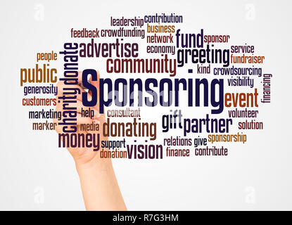 Sponsoring word cloud and hand with marker concept on white background. Stock Photo