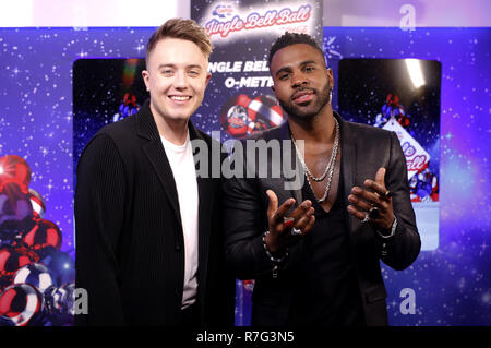 Jason Derulo and Capital FM presenter Roman Kemp (left) backstage in the on air studio during day two of Capital's Jingle Bell Ball with Coca-Cola at London's O2 Arena. Stock Photo