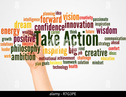 Take Action word cloud and hand with marker concept on white background. Stock Photo