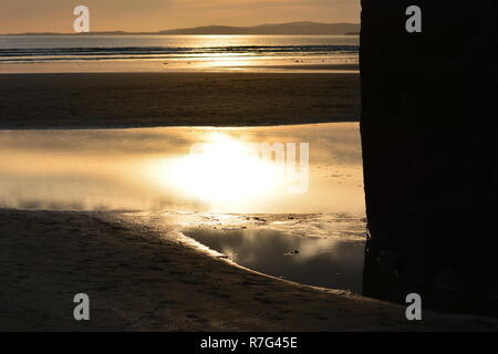 Sunset over Blackrock Sands in Gwynedd, Wales Stock Photo