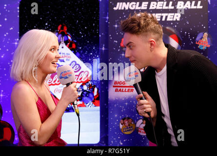 Zara Larsson with Capital FM presenter Roman Kemp backstage in the on air studio during day two of Capital's Jingle Bell Ball with Coca-Cola at London's O2 Arena. Stock Photo