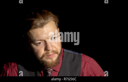 image of a man with a beard on a black background Stock Photo