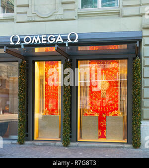 Zurich, Switzerland - December 26, 2016: window of the Omega store on Bahnhofstrasse street with Christmas decorations. Omega is a brand of the Omega  Stock Photo