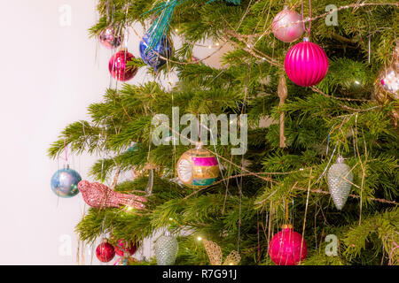 Baubles on real Christmas tree. Stock Photo
