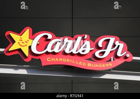 Tilst, Denmark - October 14, 2018: Carl's jr logo on a wall. Carl's jr is an American fast food restaurant chain operated by CKE Restaurant Holdings Stock Photo