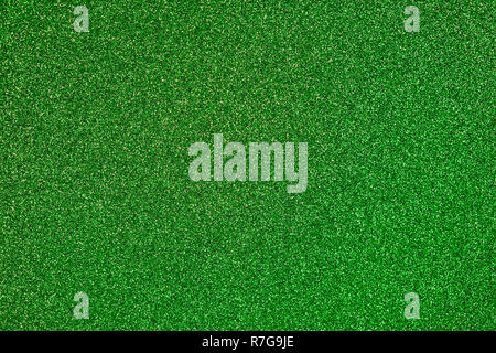 Lime green colored sand paper textured background with sparkles and glitters Stock Photo