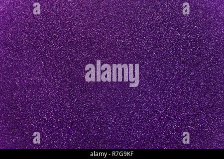 Purple colored glitter paper texture or vintage background Stock