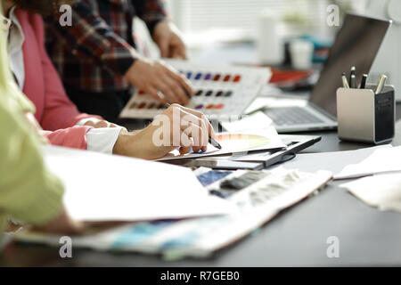 close up.fashion designer working with color palette