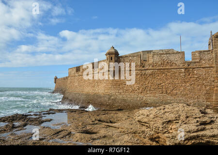 The fortress of San Sebastian (Castillo de San Sebastian) in Cadiz. Architectural and historical landmark on the Atlantic coast of Andalusia in Spain. Stock Photo