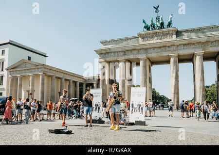 Germany, Berlin, September 05, 2018: A group called Blowing Doozy plays jazz on the square next to the Brandenburg Gate. A musical performance for tourists and locals. Stock Photo