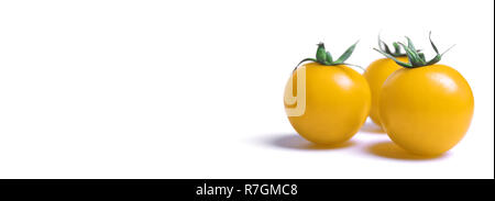 Close-up of yellow cherry tomatoes isolated on white Background. Stock Photo