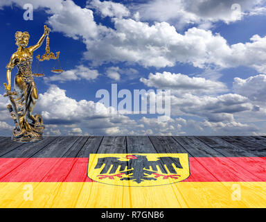 statue of Justice on the Germany flag background Stock Photo