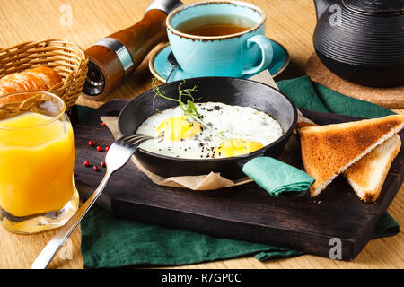 delicious breakfast of scrambled eggs with sausage in a restaurant Stock Photo