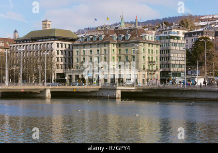 Zurich, Switzerland - January 18, 2016: buildings of the city of Zurich along the Limmat river in winter. Zurich is the largest city in Switzerland an Stock Photo