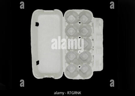 Cardboard empty tray for ten pieces eggs isolated on black background Stock Photo