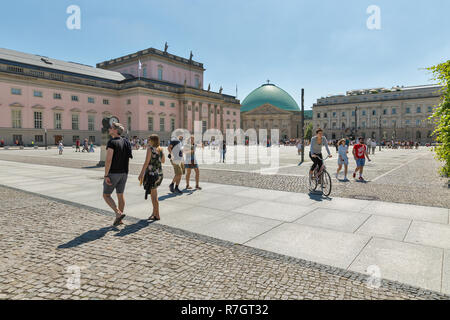 BERLIN, GERMANY - JULY 14, 2018: People walk along Bebelplatz square with State Opera, Hotel de Rome and St. Hedwig Cathedral. Berlin is the capital a Stock Photo