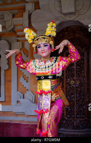 A young girl performs a traditional Balinese dance Stock Photo