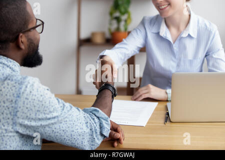 Diverse business people shaking hands greeting each other Stock Photo