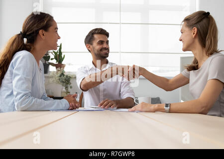 Business partners shaking hands greeting each other Stock Photo