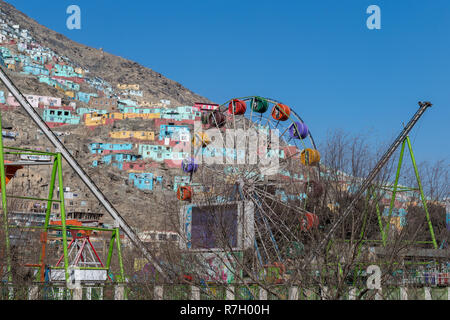 Ferris Wheel and Roller Coaster at City Park Amusement Park, Kabul, Kabul Province, Afghanistan Stock Photo