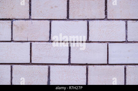 white decorative marble tiled brick wall. background, texture. Stock Photo