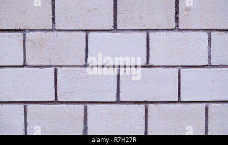 white decorative marble tiled brick wall. background, texture. Stock Photo