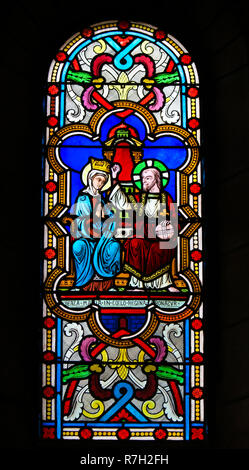 Stained Glass in the Cathedral of Monaco depicting the Coronation of Mother Mary by Jesus Christ in Heaven Stock Photo
