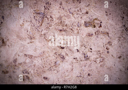 pink marble texture interspersed with quartz. vignette, background, geological. Stock Photo