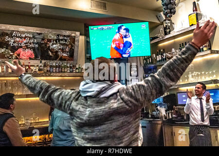 New York, USA. 9th Dec 2018. River Plate fans celebrate in an Argentine restaurant in New York city as their team beats rivals Boca Juniors 3-1 to win the Libertadores Cup.  Photo by Enrique Shore Credit: Enrique Shore/Alamy Live News Stock Photo