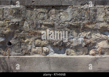 Wall with old stone blocks texture. Stock Photo