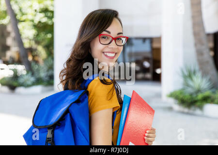 Portrait of a female student with eyeglasses outdoor in the city Stock Photo