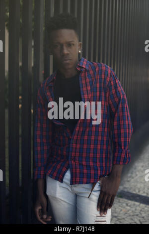 Portrait of an african american young adult man outdoor in the city Stock Photo