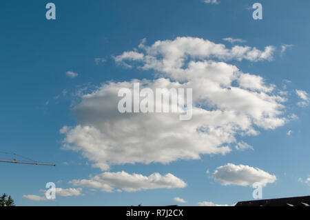 Cumulus Cloud formations with blue sky background. Photographed in Bavaria, Germany Stock Photo