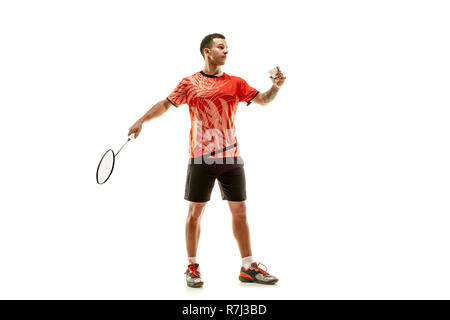 Young man playing badminton over white studio background. Fit male athlete isolated on white. badminton player in action, motion, movement. attack and defense concept Stock Photo