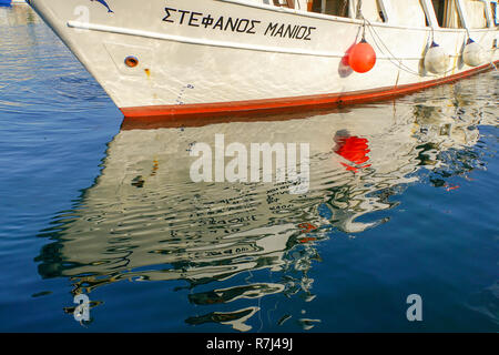 Boats reflecting in the water in a harbour Stock Photo