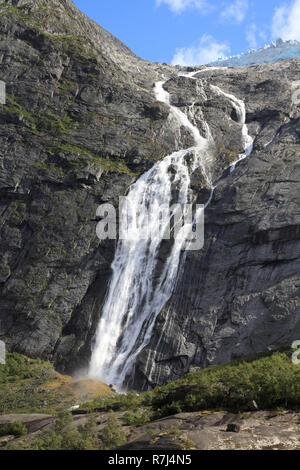 Norway, Jostedalsbreen National Park. Waterfall originating from Jostedalsbreen glacier, falling into Briksdalen valley. Stock Photo