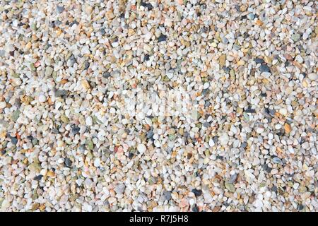 Colorful pebbly beach background from Crete, Greece. Shingle beach. Stock Photo