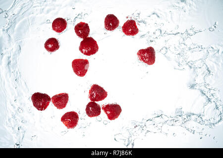 Raspberries Water Splash on whitebackground Stock Photo