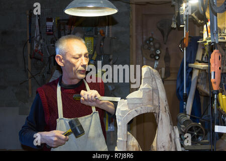 master carpenter working in his woodwork workshop Stock Photo