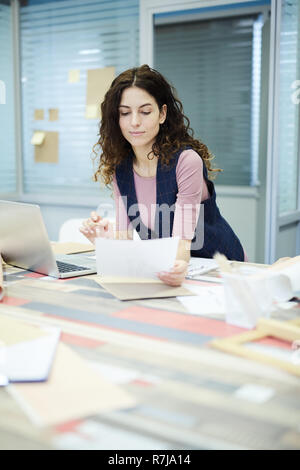 Concentrated fashion designer thinking about new collection Stock Photo