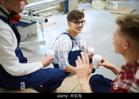 Positive young workers having break together Stock Photo