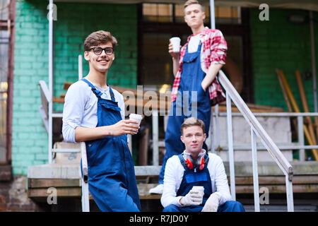 Cheerful handsome guys in workwear Stock Photo