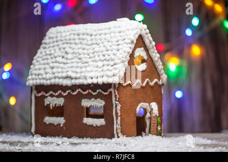 Christmas ginger bread house with bulbs background for graphic and web design, Modern simple internet concept. Trendy for website design web or mobile app. Stock Photo