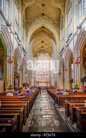 Light streaming through stained glass window inside Bath Abbey, Somerset, UK on 15 August 2015 Stock Photo