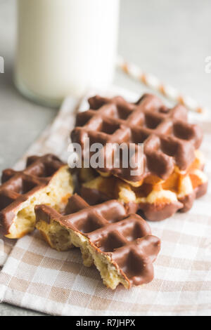 Delicious Belgian waffles with ice cream, berries and chocolate sauce ...