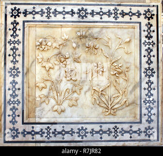 Ancient carved flower on marble in Amber Fort near Jaipur, Rajasthan, India Stock Photo