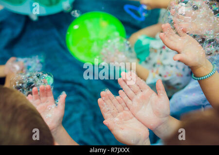 Soap bubbles on children's holiday Stock Photo