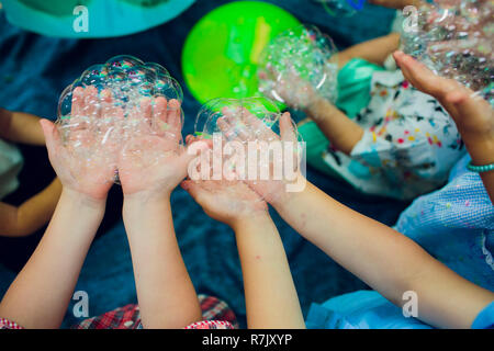 Soap bubbles on children's holiday Stock Photo