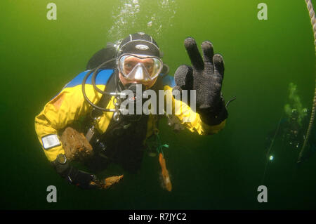 Diver takes wood fragments from a shipwreck, an unknown wooden boat, for research, 19th century, Odessa, Black Sea, Ukraine Stock Photo
