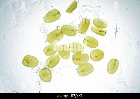 Green Grapes Water Splash on white background Stock Photo